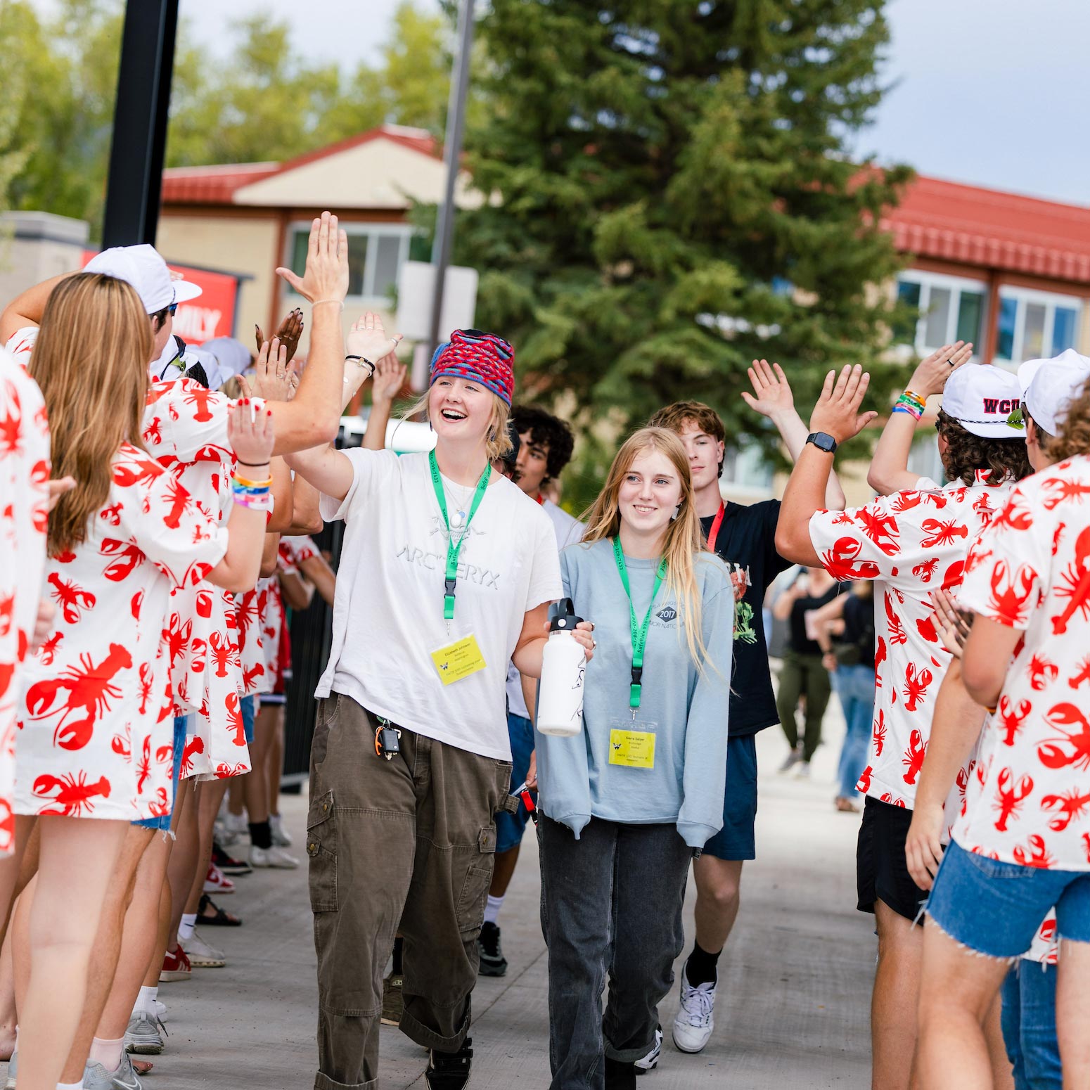 First-year students are greeted by orientation leaders as they enter the Mountaineer Bowl.