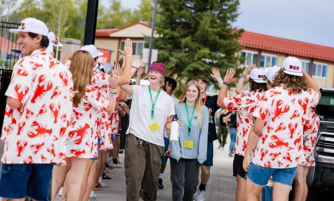 First-year students are greeted by orientation leaders as they enter the Mountaineer Bowl.