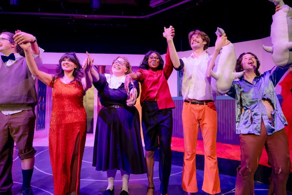 Students take a bow on stage at the end of Disaster! The Musical.
