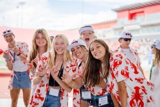 Orientation leaders gather for a group photo inside the Mountaineer Bowl.