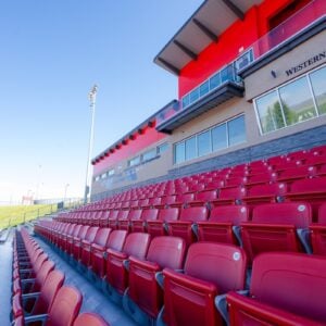 The red seats in the Mountaineer Bowl grandstands.