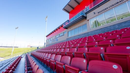 The red seats in the Mountaineer Bowl grandstands.