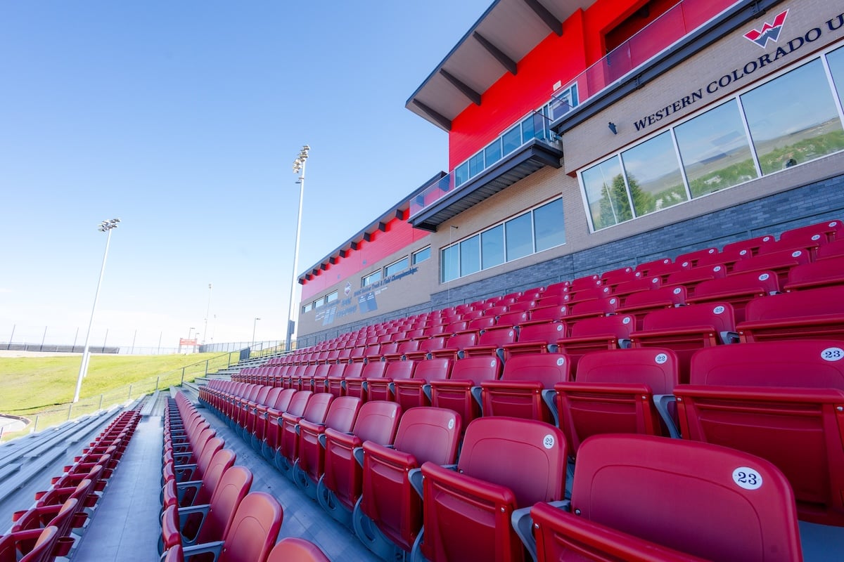The red seats in the Mountaineer Bowl grandstands.