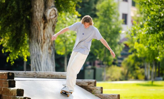 A student skateboards down a ramp at the campus skate park.