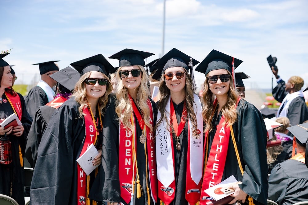 Graduates gather for a group photo.