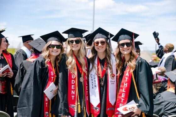 Graduates gather for a group photo.