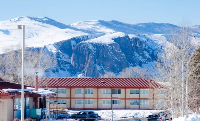 The Escalante Complex exterior in the winter with the Palisades in the background