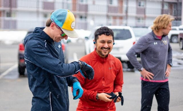 Students smile and check their watches before a time trial in a HAP class