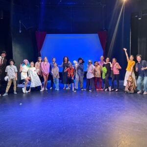 Heather Hughes poses with the students at Theatre Camp.