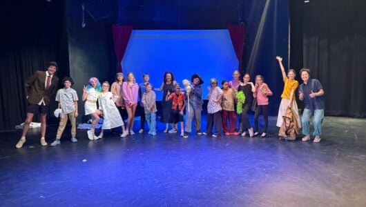 Heather Hughes poses with the students at Theatre Camp.