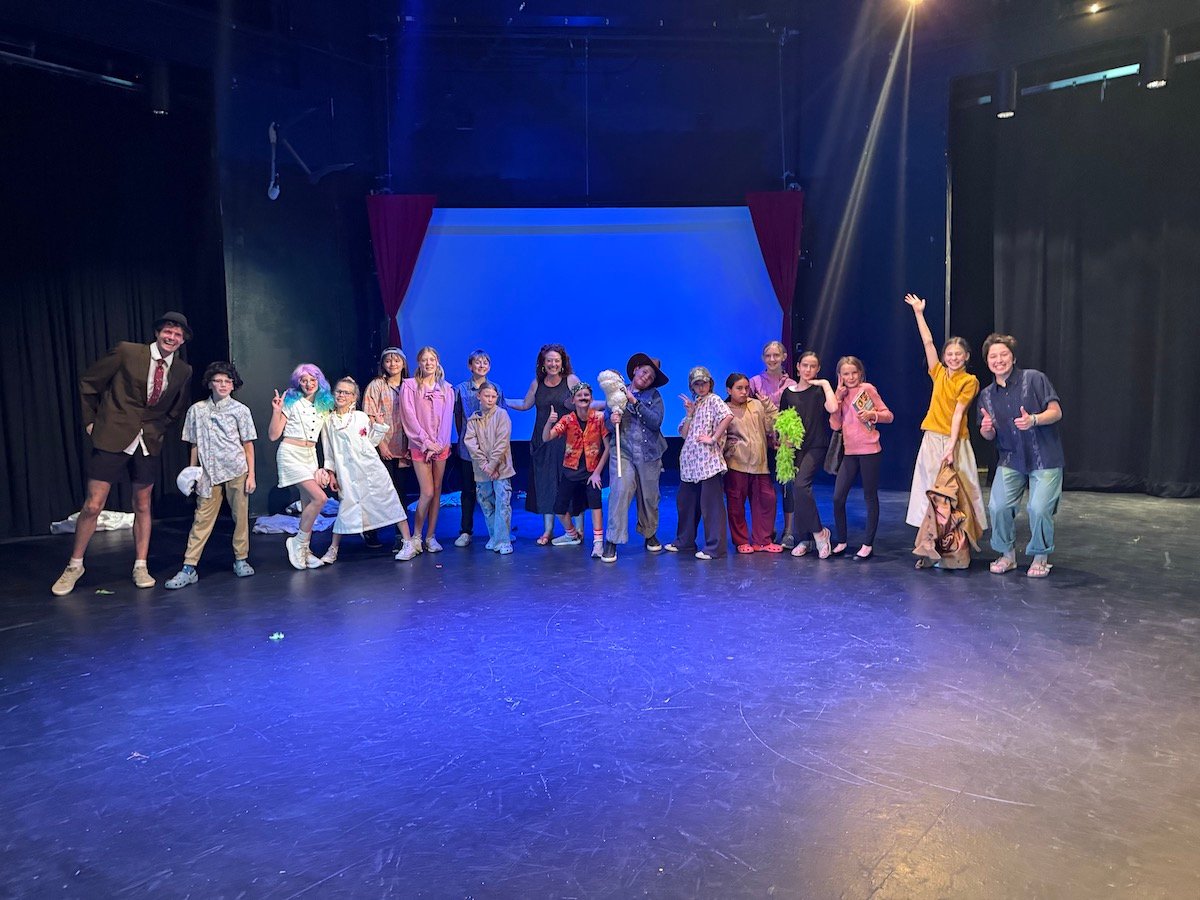 Heather Hughes poses with the students at Theatre Camp.