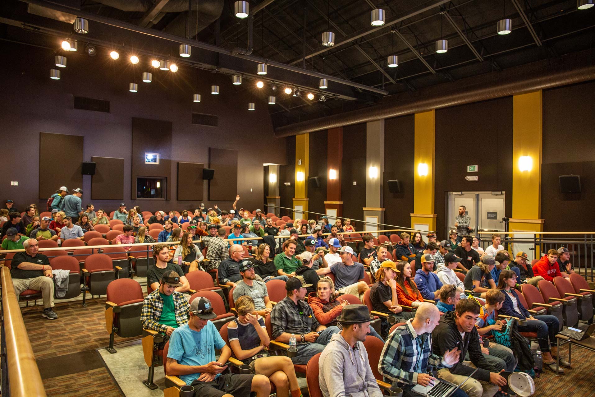 An audience sits inside the UC Theater.
