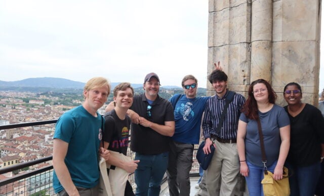 Art students standing at a lookout with Florence, Italy in the background.