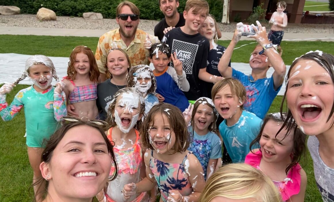 Group selfie of kids and staff attending a Junior Mountaineers summer camp.