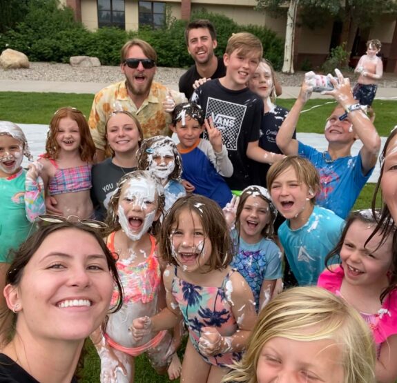 Group selfie of kids and staff attending a Junior Mountaineers summer camp.