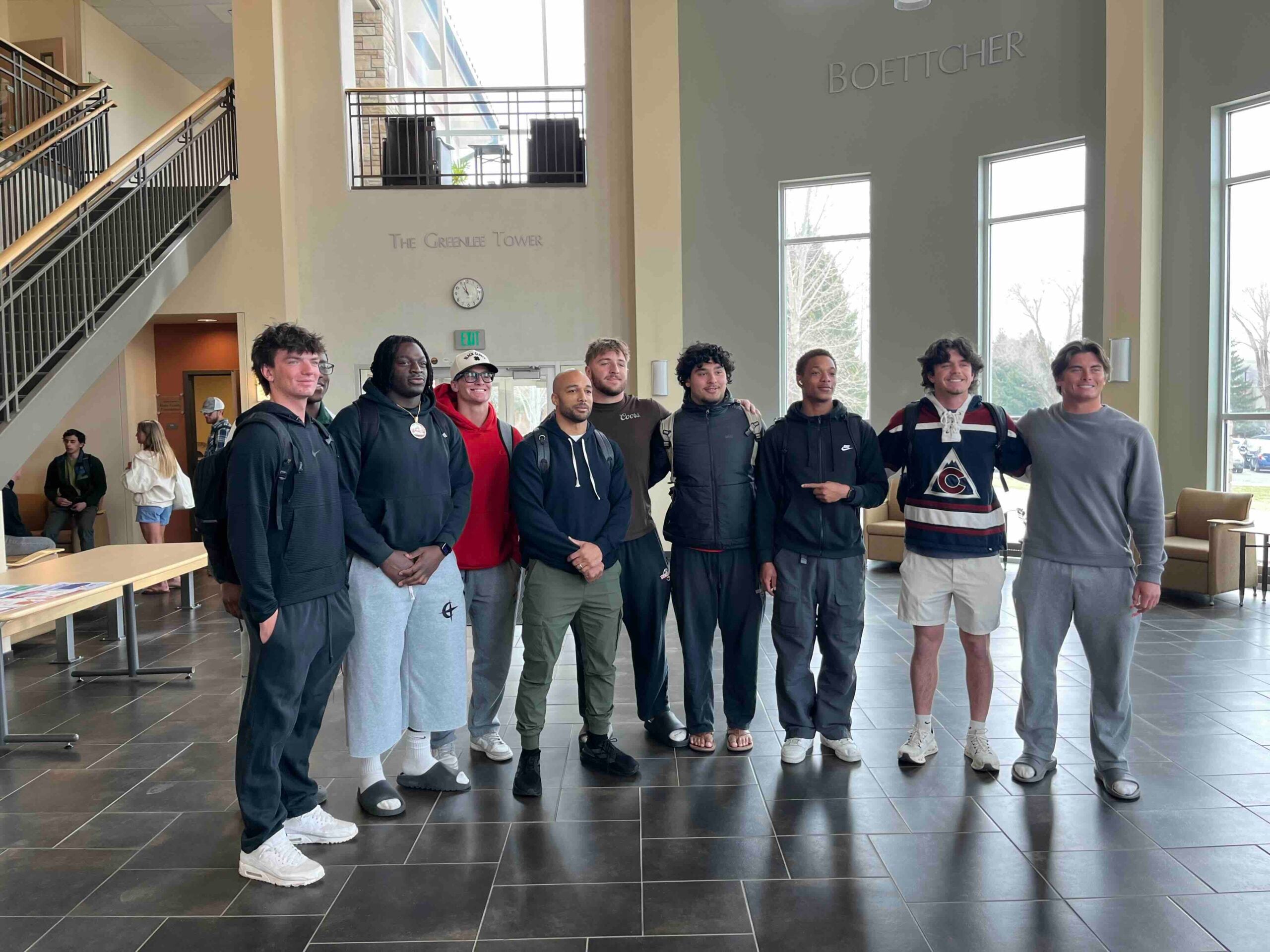 Austin Ekeler poses with students.