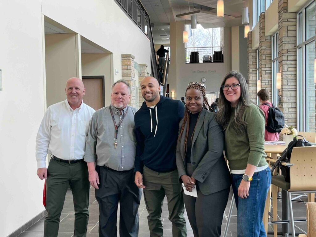 Austin Ekeler and faculty from the Business Department