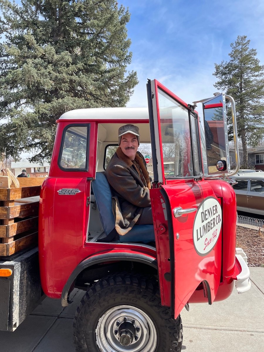 Steven Cole Hughes on set in a truck.