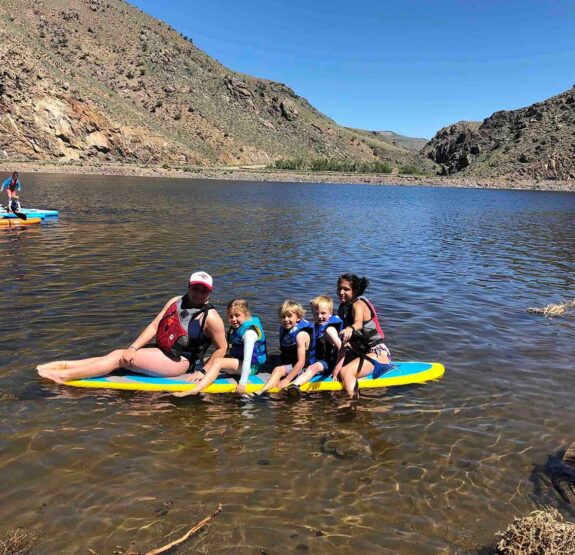 Junior Mountaineer Camps paddleboarding.