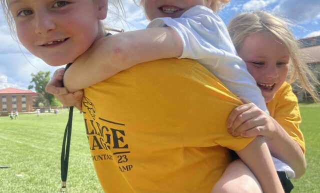 Junior Mountaineer Campers play outside.