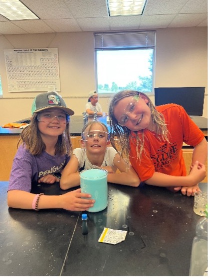Junior Mountaineer campers work on a science experiment.