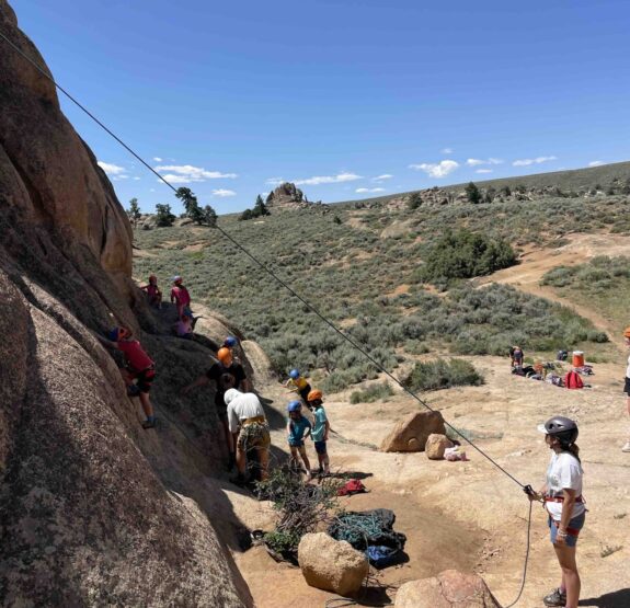 Junior Mountaineer Campers rock climbing.