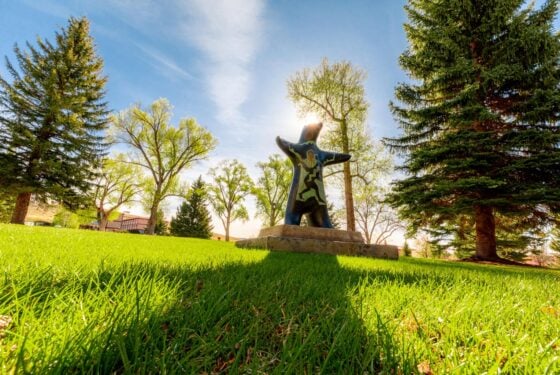 A photo of the infamous Pathfinder Bear near the Leslie J. Savage Library and Taylor Hall