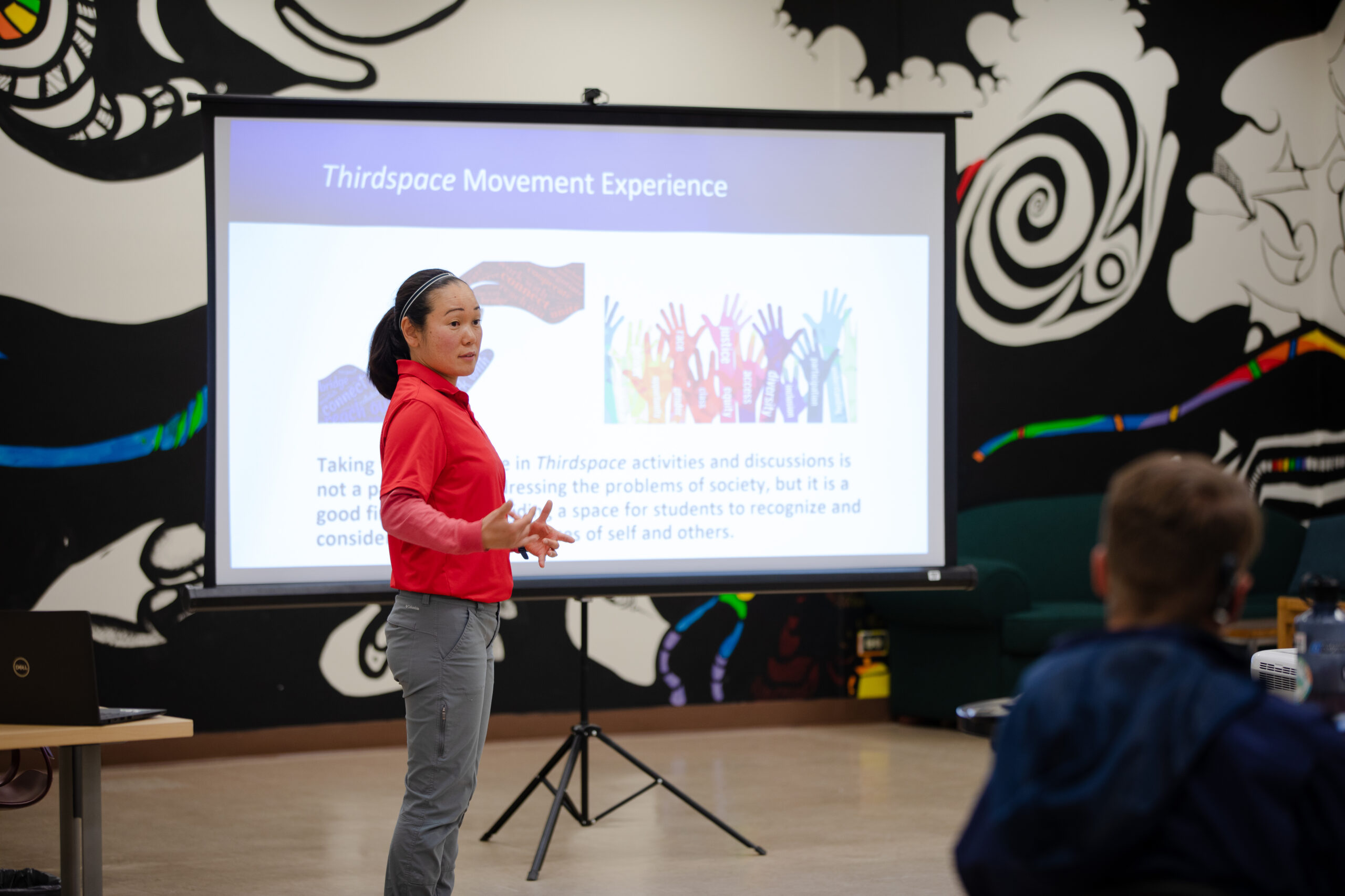 Kanae Haneishi presents about her two projects on JEDI in Physical Education to a group of faculty and staff during a session of Lunch with Western Scholars in the library's Mural Room.