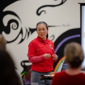 Kanae Haneishi presents about her two projects on JEDI in Physical Education to a group of faculty and staff during a session of Lunch with Western Scholars in the library's Mural Room.
