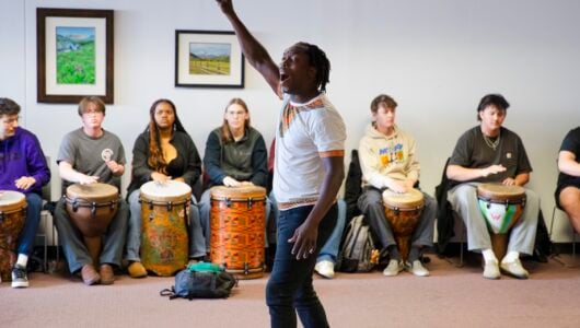 Fara Tolno leads students in a drum circle for his annual West African Drumming & Cultural Exchange workshop.