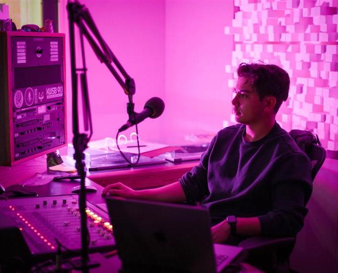 Student Kai Vong works at the KWSB radio station.