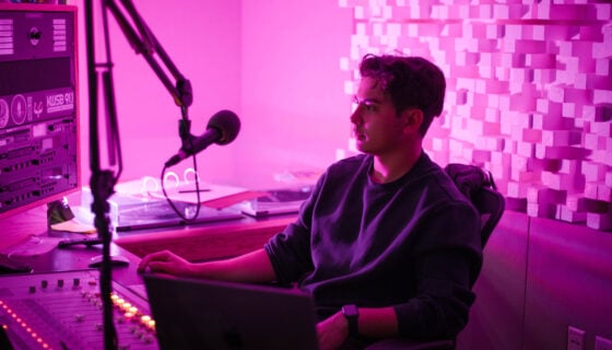 Kai Vong sits in the KWSB studio during his jazz DJ show for the radio station.