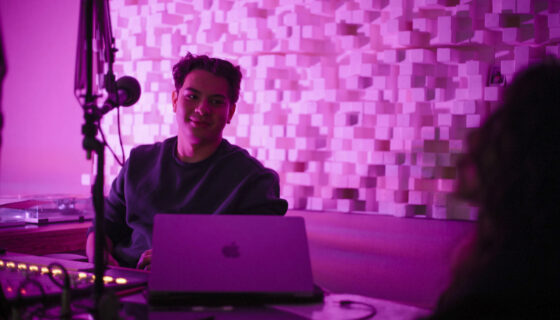 Kai Vong sits in the KWSB studio during his jazz DJ show for the radio station.