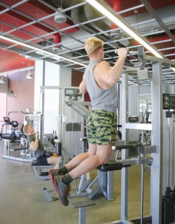 Michael Adams uses an assisted pull-up machine in the field house gym.
