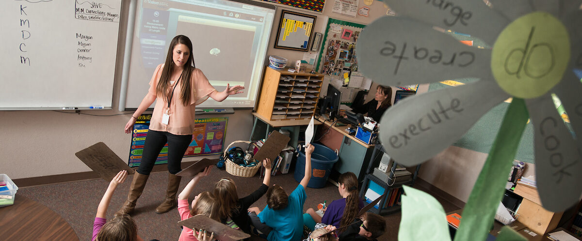 A class listens to a student teacher at Gunnison Elementary.