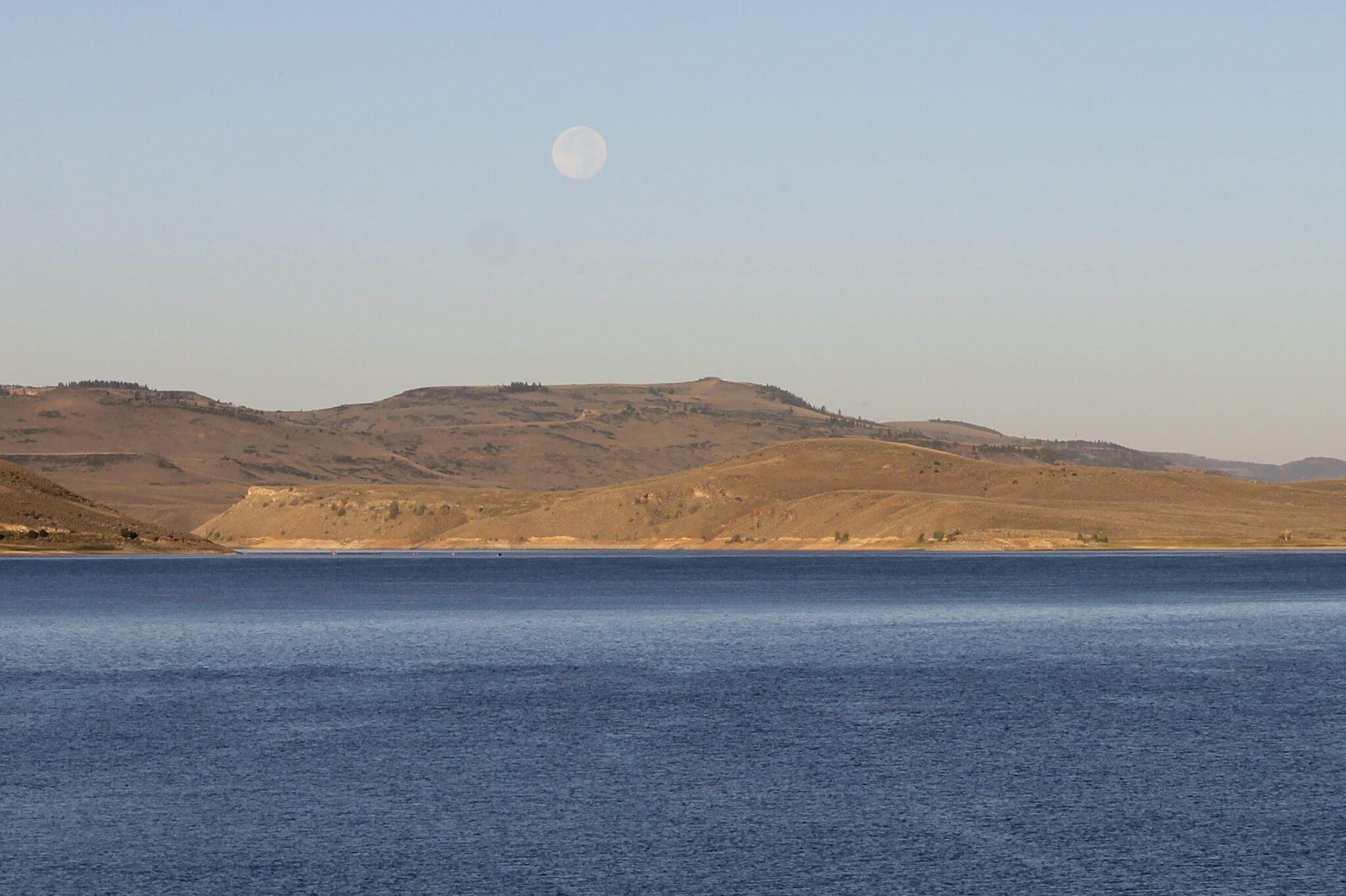 Blue Mesa Reservoir with the moon above it