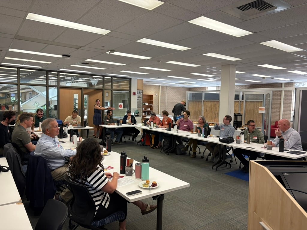 New faculty fill a classroom.