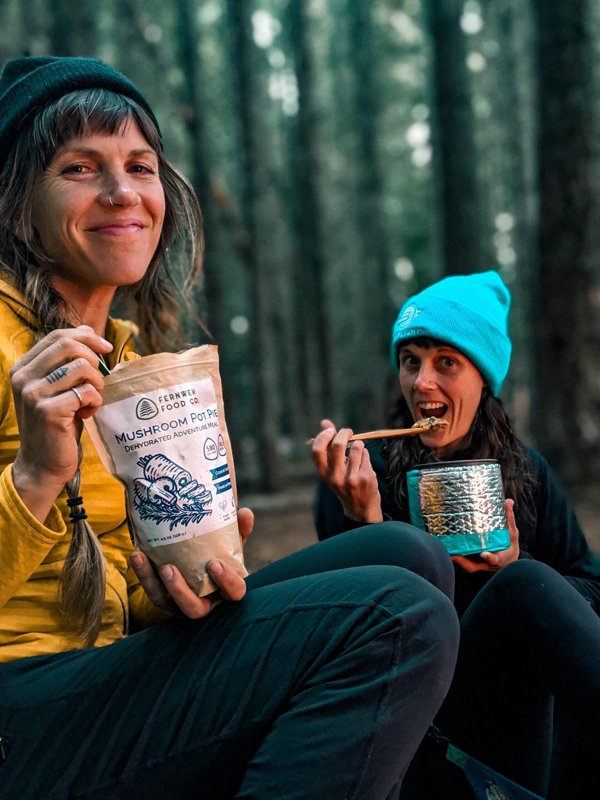 Two women sampling Fernweh Food Co. Products