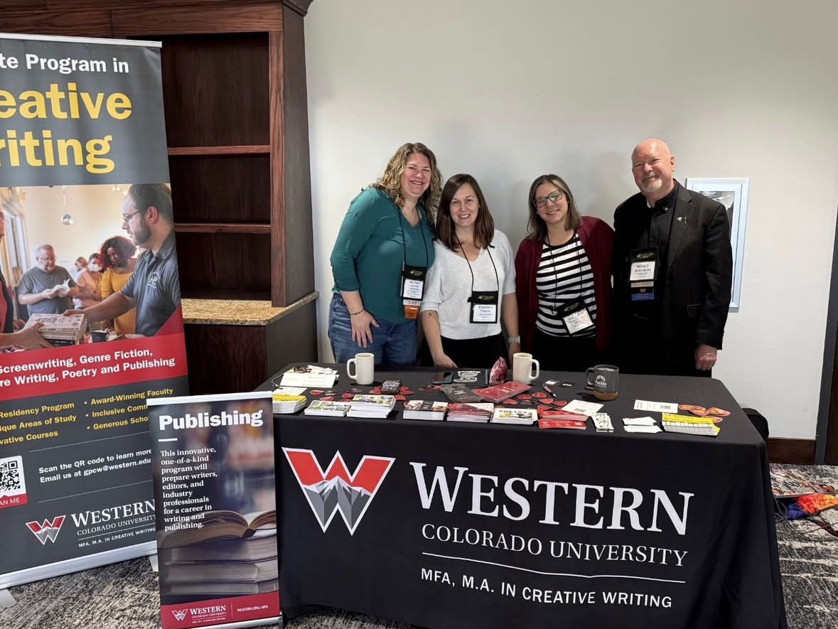 Group photo of Creative Writing Faculty at a recruiting booth.