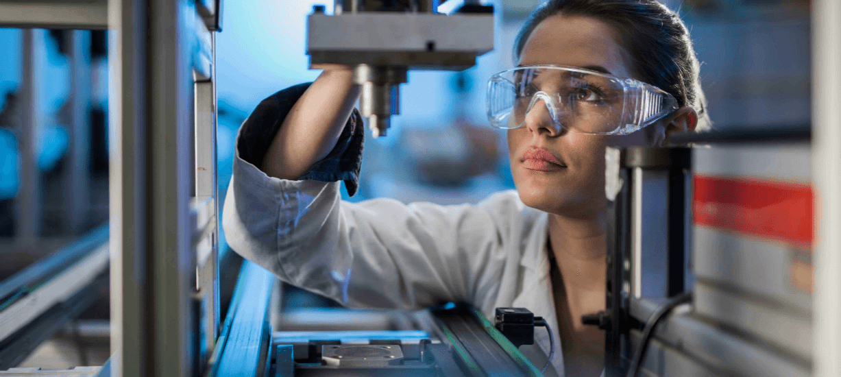 Student looks at lab equipment