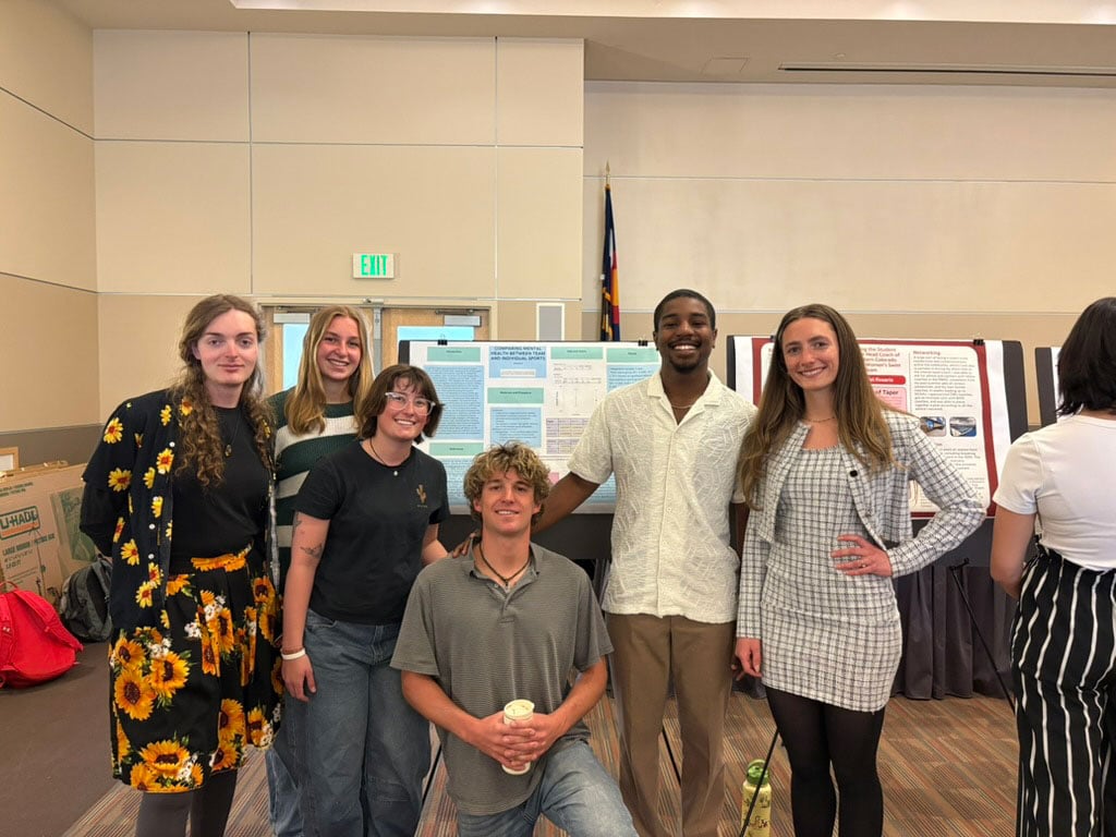 Group photo of students in front of research.
