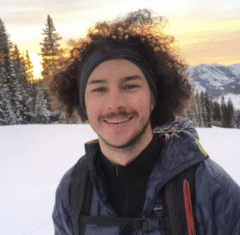 Headshot of Dylan Wood skinning up Mt. Crested Butte at sunset.