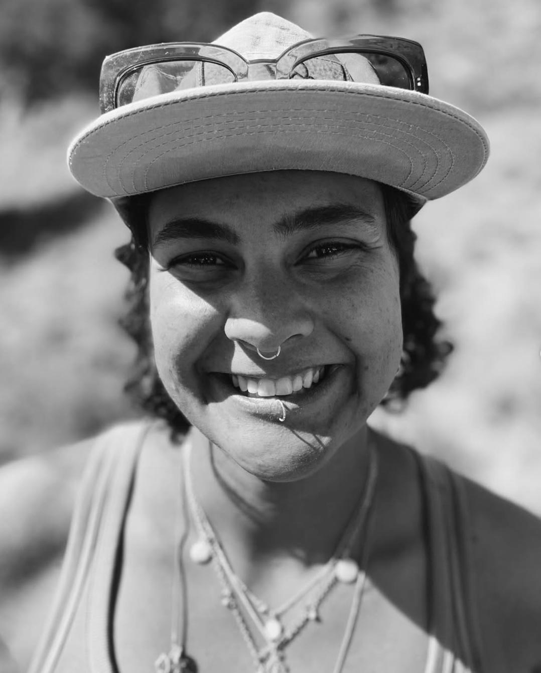 Headshot of Hayley Wood wearing a baseball hat.