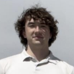 Headshot of Thomas Rathman.