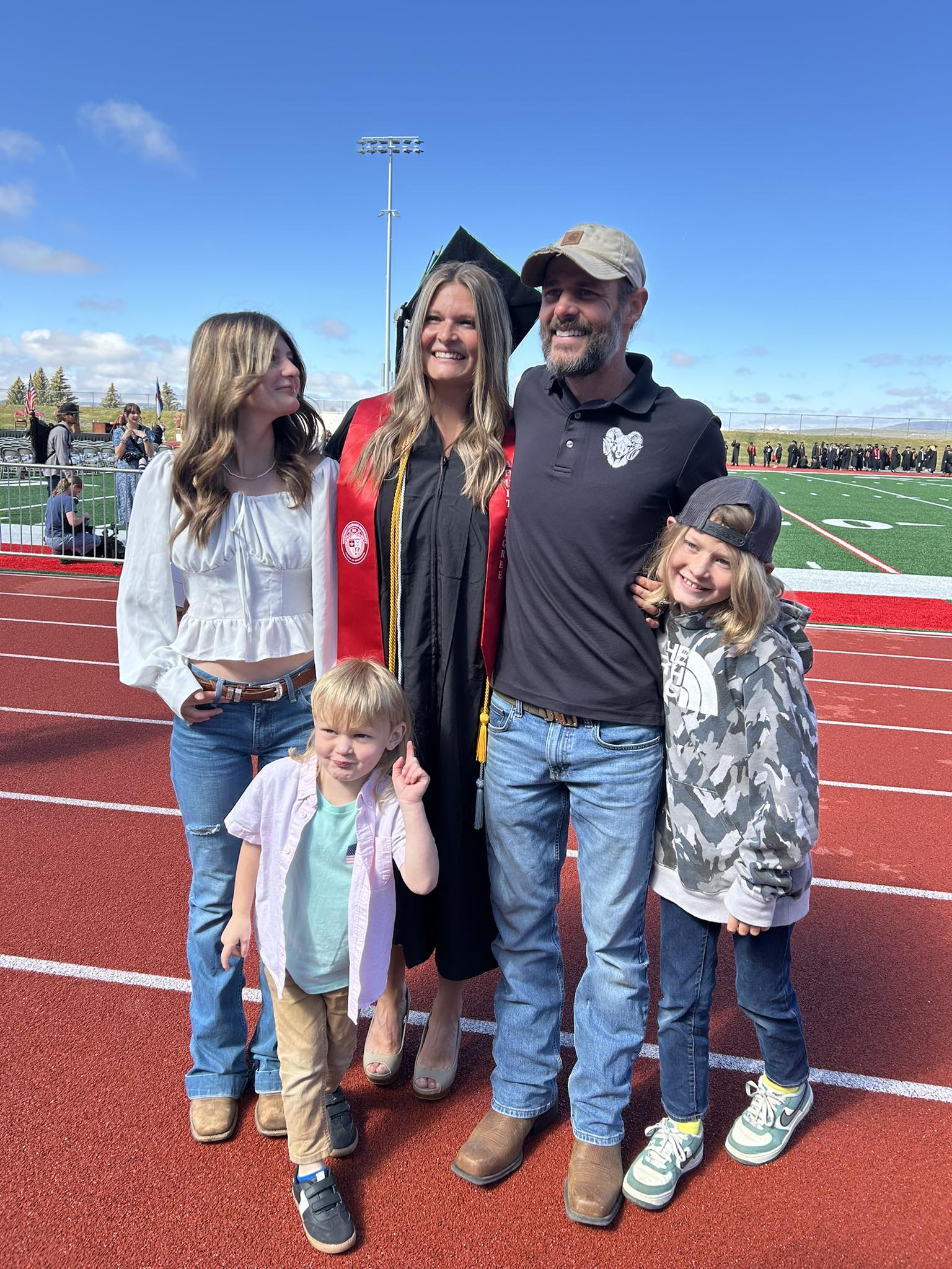 Taylor Hubbard poses with her family at commencement.