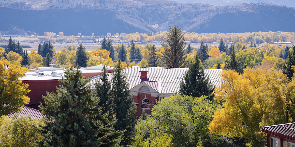 Taylor Hall in the fall with the San Juan Mountains in the background.