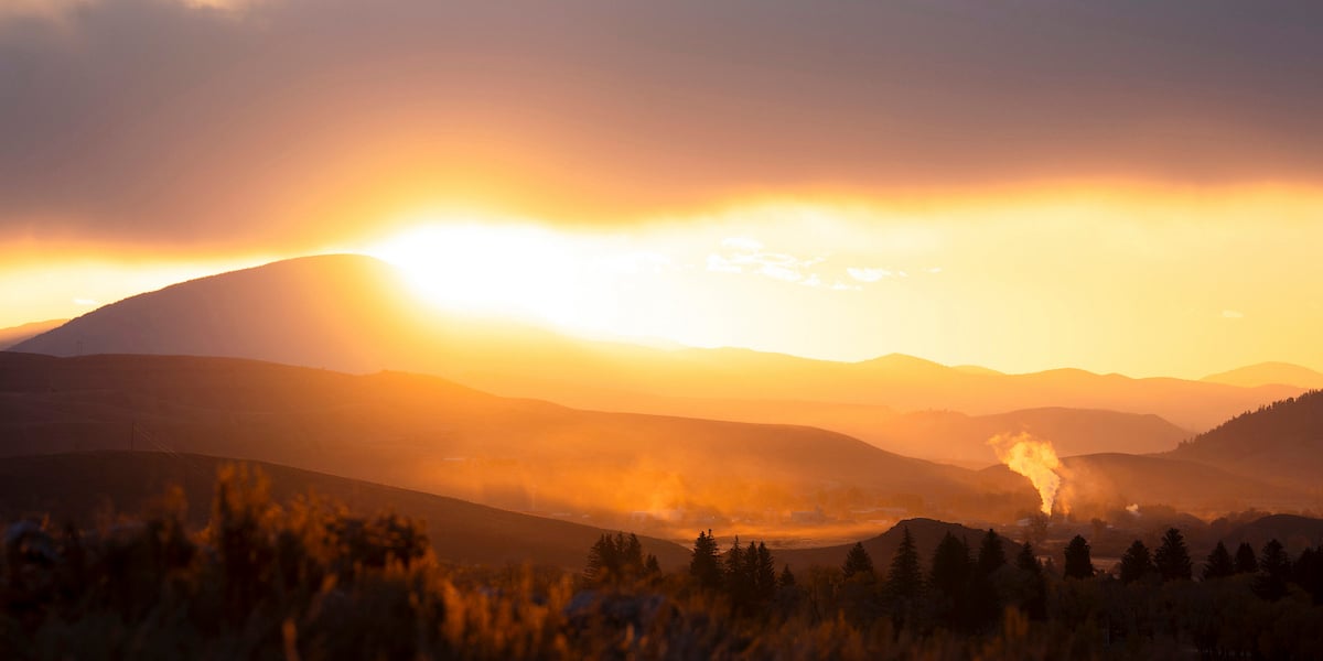 A photo of the Tomichi Dome during a fall sunrise.