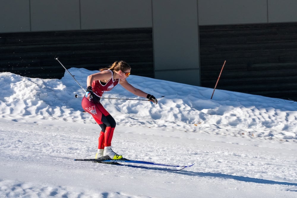 A Western Nordic Ski Team member skis on the course at the competition.