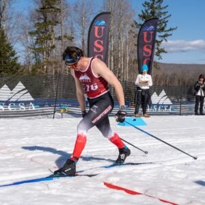 A Western Nordic Ski Team member skis on the course at the competition.