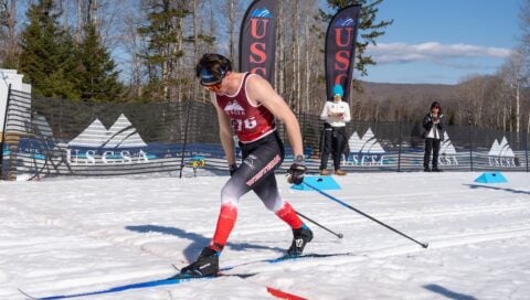 A Western Nordic Ski Team member skis on the course at the competition.